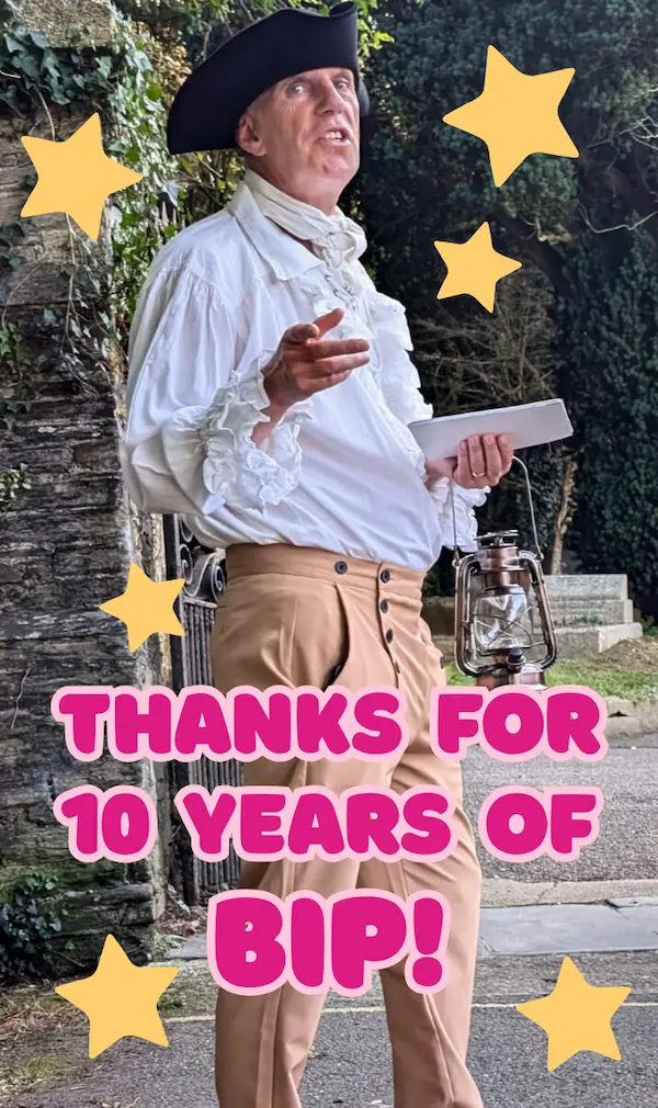 Geoff in a white frilly shirt, holding an old-fashioned sea lantern.